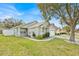 Single-story house with a landscaped lawn and attached garage at 2627 Oneida Loop, Kissimmee, FL 34747