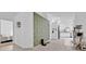 Bright hallway with access to bedroom and kitchen at 2627 Oneida Loop, Kissimmee, FL 34747