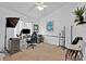 Home office with a desk, chair, and ample natural light at 2627 Oneida Loop, Kissimmee, FL 34747