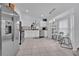Bright kitchen featuring stainless steel appliances and white cabinetry at 2627 Oneida Loop, Kissimmee, FL 34747
