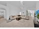 Spacious living area with large sectional sofa and chandelier at 2627 Oneida Loop, Kissimmee, FL 34747