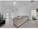 Spacious living room with a large sofa and access to the pool at 2627 Oneida Loop, Kissimmee, FL 34747