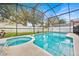 Refreshing pool and spa with screened enclosure at 2627 Oneida Loop, Kissimmee, FL 34747