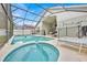 Enjoy this pool and spa with screened enclosure at 2627 Oneida Loop, Kissimmee, FL 34747