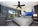 Spacious bedroom with a large window and a captivating mural at 2793 Lido Key Dr, Kissimmee, FL 34747