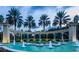 Elegant community entrance with fountain and palm trees at dusk at 2793 Lido Key Dr, Kissimmee, FL 34747