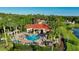 Aerial view of community pool, clubhouse, and lush landscaping at 2793 Lido Key Dr, Kissimmee, FL 34747
