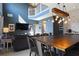 Open concept dining room with a large wooden table and chandelier at 2793 Lido Key Dr, Kissimmee, FL 34747