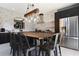 Modern kitchen with dark cabinetry, quartz countertops, and a large island at 2793 Lido Key Dr, Kissimmee, FL 34747