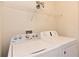 Laundry room with washer, dryer, and overhead shelving at 2793 Lido Key Dr, Kissimmee, FL 34747