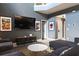 Living room with sectional sofa and large TV at 2793 Lido Key Dr, Kissimmee, FL 34747