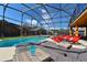Inviting pool area with lounge chairs and a screened enclosure at 2793 Lido Key Dr, Kissimmee, FL 34747