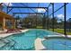 Refreshing pool and spa with ample seating and screened enclosure at 2793 Lido Key Dr, Kissimmee, FL 34747