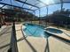 Relaxing pool and spa with a screened enclosure and plenty of sun at 2793 Lido Key Dr, Kissimmee, FL 34747