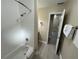 Bathroom with tub, shower, and view of bedroom at 3187 Sea World Ct, Kissimmee, FL 34746