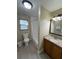 Bathroom with tub, shower, granite vanity and flooring at 3187 Sea World Ct, Kissimmee, FL 34746