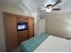 Bedroom with king bed, built-in entertainment center and closet at 3187 Sea World Ct, Kissimmee, FL 34746