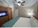 King size bed, built in armoire and closet in this bedroom at 3187 Sea World Ct, Kissimmee, FL 34746