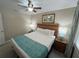 King-size bed, nightstands, and artwork in a well-lit bedroom at 3187 Sea World Ct, Kissimmee, FL 34746