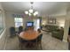 Bright dining area with table and chairs, kitchen view at 3187 Sea World Ct, Kissimmee, FL 34746