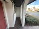 Brick-paved entryway with red door and view of parking lot at 3187 Sea World Ct, Kissimmee, FL 34746