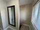 Hallway with mirror and stairs, showing access to upper level at 3187 Sea World Ct, Kissimmee, FL 34746