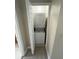 Stackable washer and dryer in a dedicated closet at 3187 Sea World Ct, Kissimmee, FL 34746