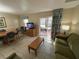 Living area showcasing a sofa, coffee table, and TV at 3187 Sea World Ct, Kissimmee, FL 34746