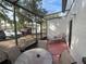 Screened-in patio with seating and view of parking lot at 3187 Sea World Ct, Kissimmee, FL 34746