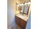 Bathroom vanity with a granite countertop and updated fixtures at 3197 Sea World Ct, Kissimmee, FL 34746