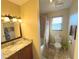 Bathroom with a sink, toilet, and shower, featuring modern fixtures and finishes at 3197 Sea World Ct, Kissimmee, FL 34746