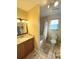 Bathroom with a sink, toilet, and shower, featuring modern fixtures and finishes at 3197 Sea World Ct, Kissimmee, FL 34746