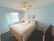 Cozy bedroom with a ceiling fan, comfortable bed, and charming decor at 3197 Sea World Ct, Kissimmee, FL 34746