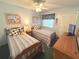 This bedroom features 2 twin beds, neutral walls and ceiling fan at 3197 Sea World Ct, Kissimmee, FL 34746