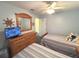 Bedroom with two twin beds, ceiling fan, closet and natural light at 3197 Sea World Ct, Kissimmee, FL 34746