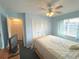 Bright and airy bedroom with a ceiling fan, comfortable bed, and neutral decor at 3197 Sea World Ct, Kissimmee, FL 34746