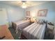 Bedroom with two twin beds, ceiling fan, closet and natural light at 3197 Sea World Ct, Kissimmee, FL 34746