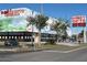Exterior view of Disney Gifts retail space with signage and ample parking at 3197 Sea World Ct, Kissimmee, FL 34746