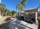 Poolside cabanas with lounge chairs at the community pool at 3197 Sea World Ct, Kissimmee, FL 34746
