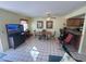 Dining area with a wooden table and chairs, adjacent to a kitchen at 3197 Sea World Ct, Kissimmee, FL 34746