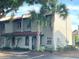 Inviting multi-level townhome with beautiful landscaping and mature palm trees at 3197 Sea World Ct, Kissimmee, FL 34746