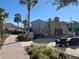 Outdoor community stone fireplace and seating area with brick sidewalks and manicured landscaping at 3197 Sea World Ct, Kissimmee, FL 34746
