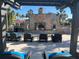 Cozy outdoor fireplace with seating area at 3197 Sea World Ct, Kissimmee, FL 34746