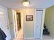 Hallway with access to the bathroom, stairs, and exterior doors at 3197 Sea World Ct, Kissimmee, FL 34746