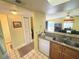 Bright hallway connecting to various rooms, including a bathroom and stairs at 3197 Sea World Ct, Kissimmee, FL 34746