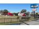 Two red helicopters at Orlando Helicopter Adventures at 3197 Sea World Ct, Kissimmee, FL 34746