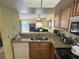 Kitchen with granite countertops and wood cabinets at 3197 Sea World Ct, Kissimmee, FL 34746