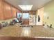 Well-lit kitchen showcasing granite countertops and ample cabinet space at 3197 Sea World Ct, Kissimmee, FL 34746