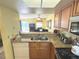 Functional kitchen with granite countertops open to the living area at 3197 Sea World Ct, Kissimmee, FL 34746