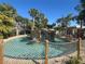 Community lazy river featuring tropical foliage and clear water, with a rock wall in the center at 3197 Sea World Ct, Kissimmee, FL 34746
